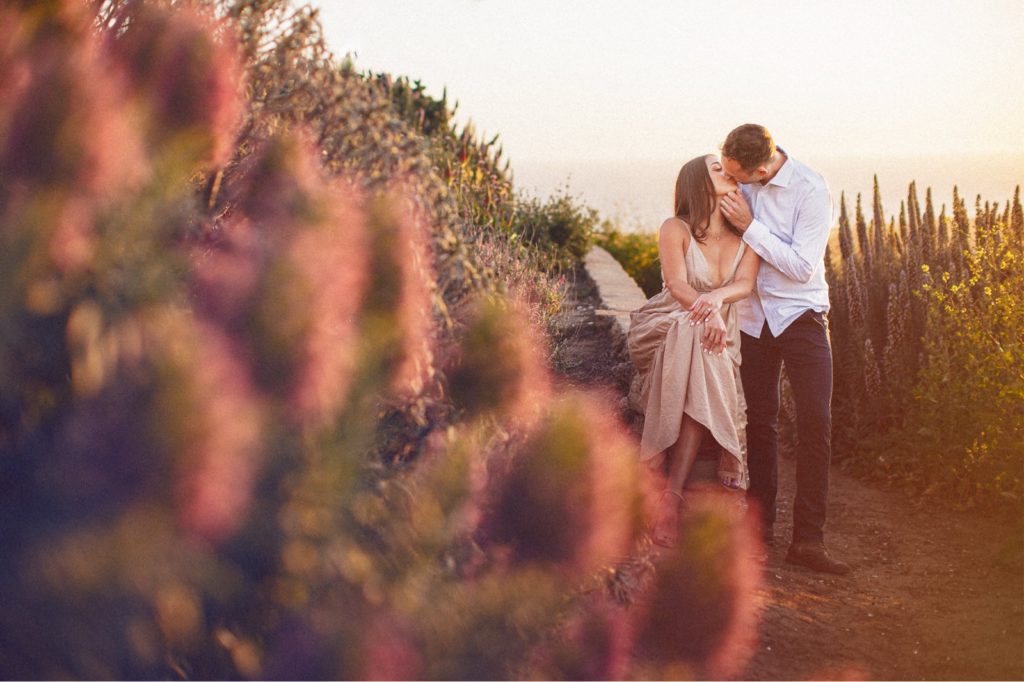 Ventura Engagement session of couple kissing with beautiful light