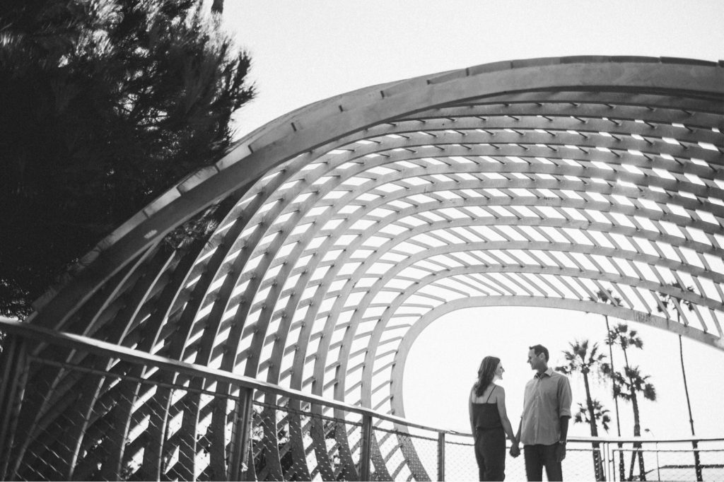 Creative Santa Monica Tongva Park Engagement Photo with artistic composition through archway