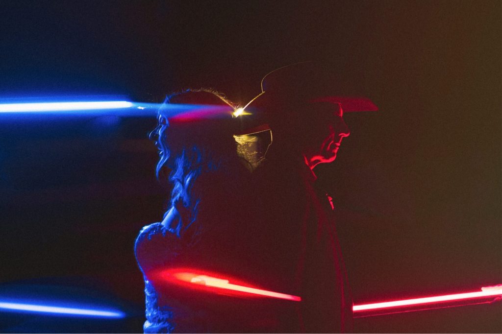 Creative and colorful couples wedding portrait with red and blue lights in Santa Barbara CA
