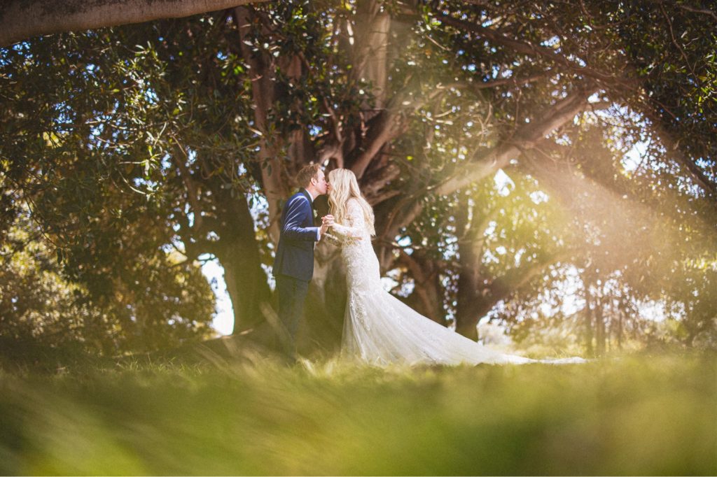 Couples first look  underneath the fig tree at Dos Pueblos Orchid Farm 