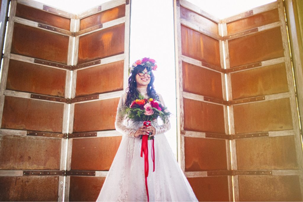 Bride in the main venue behind the doors before the ceremony at Cielo Farms Malibu
