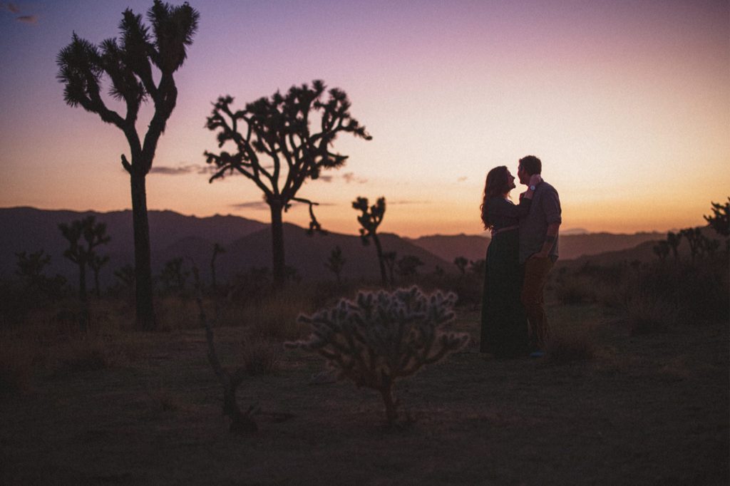 Creative Sunset engagement session at Joshua Tree with silhouette of couple